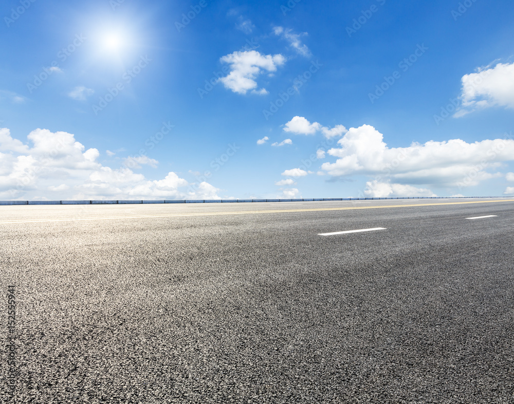 Fototapeta premium asphalt highway road under the blue sky