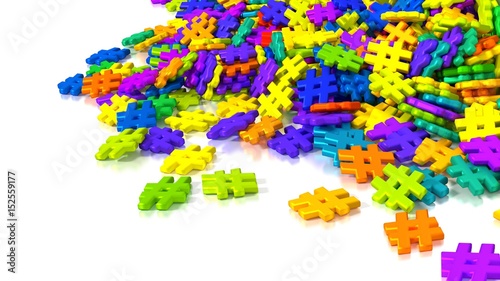 Pile of differently colored hashtag symbols on white