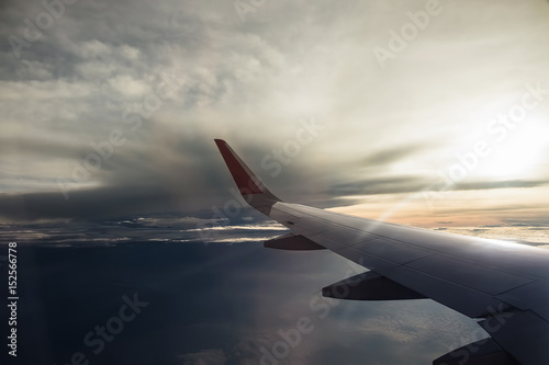 View from airplane window. Wing of an airplane flying above the