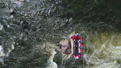 Aerial view of raft boat in whitewater. Slowmotion.