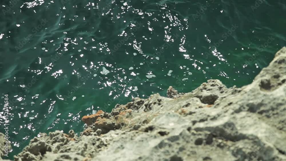 Old rocks along the shores of the bay. Blurred by winds and waves of stones Old rocks along the shores of the bay. Blurred by winds and waves of stones