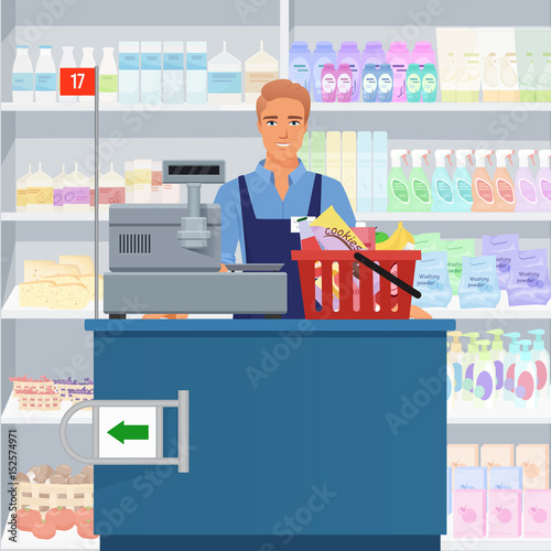 Salesman man cashier standing at checkout in supermarket.