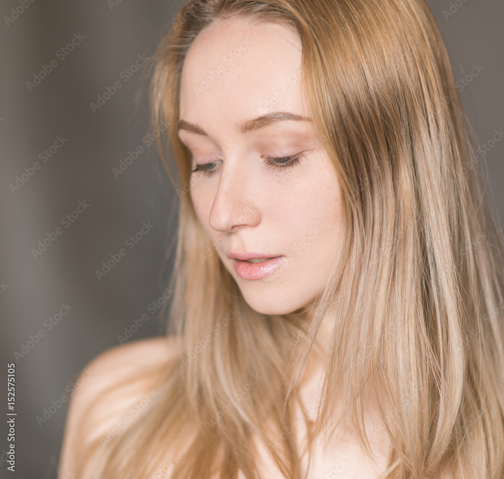 Portrait of a beautiful young woman with blue eyes. Portrait of a beautiful young woman with blue eyes.