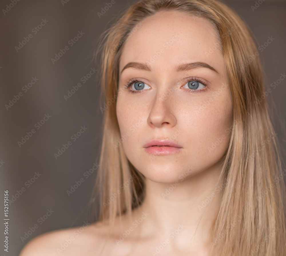 Portrait of a beautiful young woman with blue eyes. Portrait of a beautiful young woman with blue eyes.