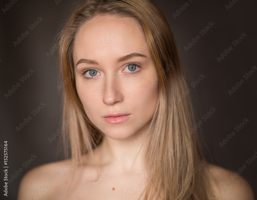 Portrait of a beautiful young woman with blue eyes. Portrait of a beautiful young woman with blue eyes.