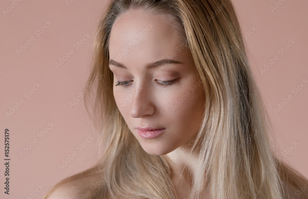 Portrait of a beautiful young woman with blue eyes. Portrait of a beautiful young woman with blue eyes.