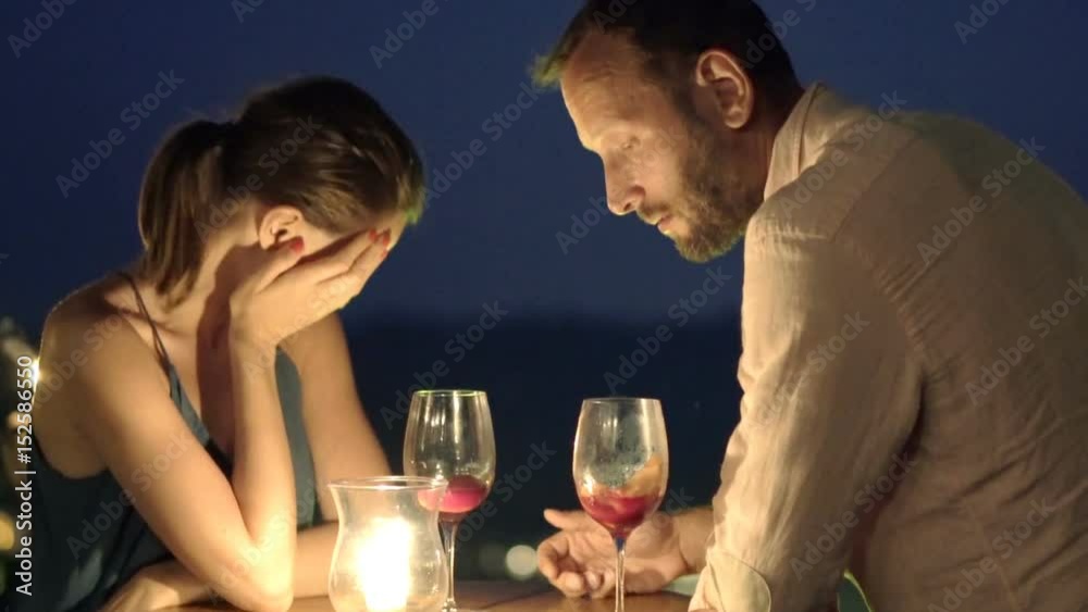 Young couple arguing, fighting in bar at night
Young couple arguing, fighting in bar at night
