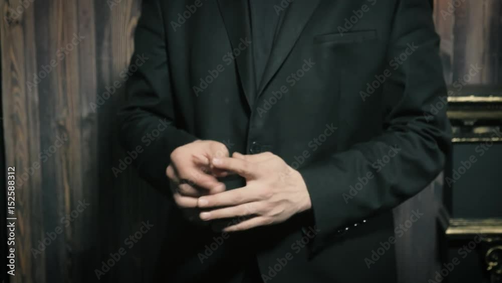 Magician shows a performance with a coin Magician shows a performance with a coin