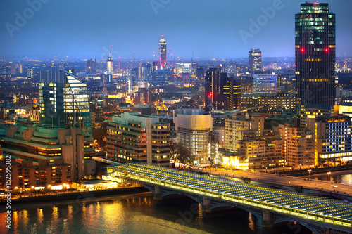 London at night, view at River Thames embankment and London bridge with night lights reflection
