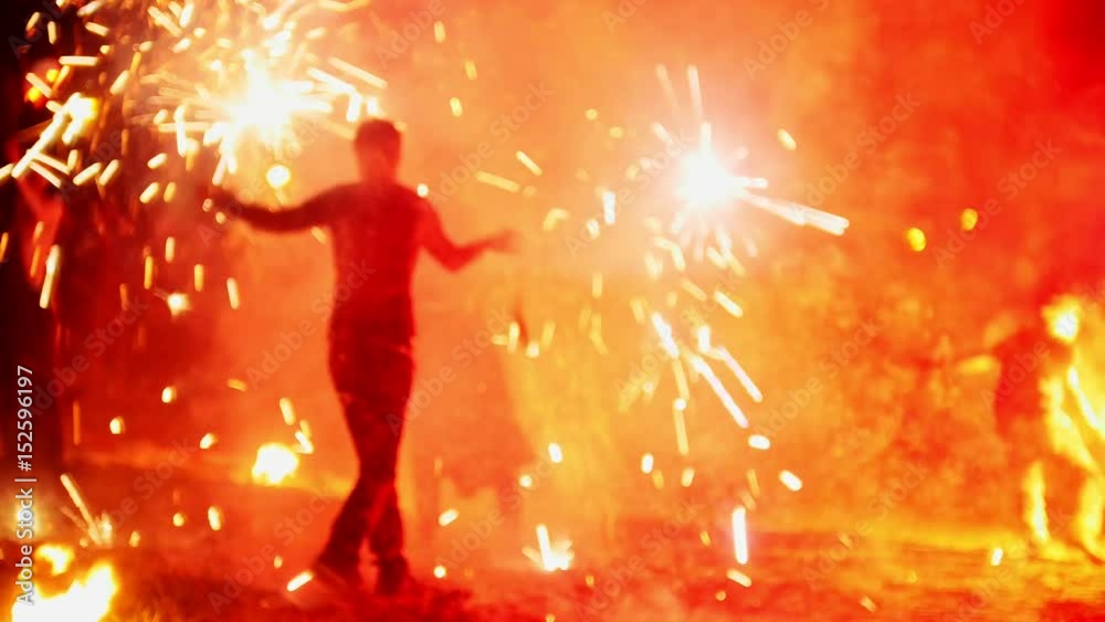 Fireworks on beach at night fire-show performance