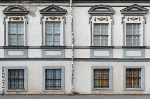 Eight vintage windows with rusty steel lattices