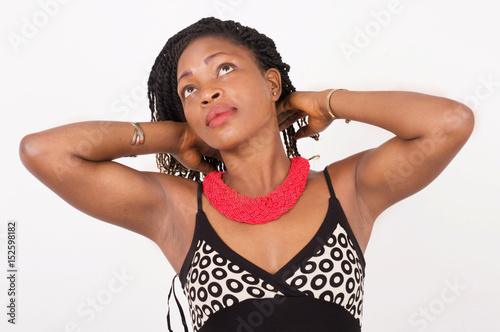 Portrait of a beautiful woman with hands on her neck. photo