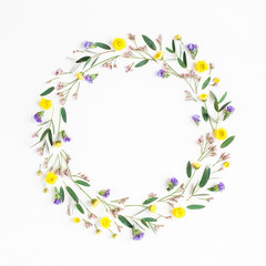 Flowers composition. Wreath made of yellow flowers and eucalyptus leaves on white background. Flat lay, top view
