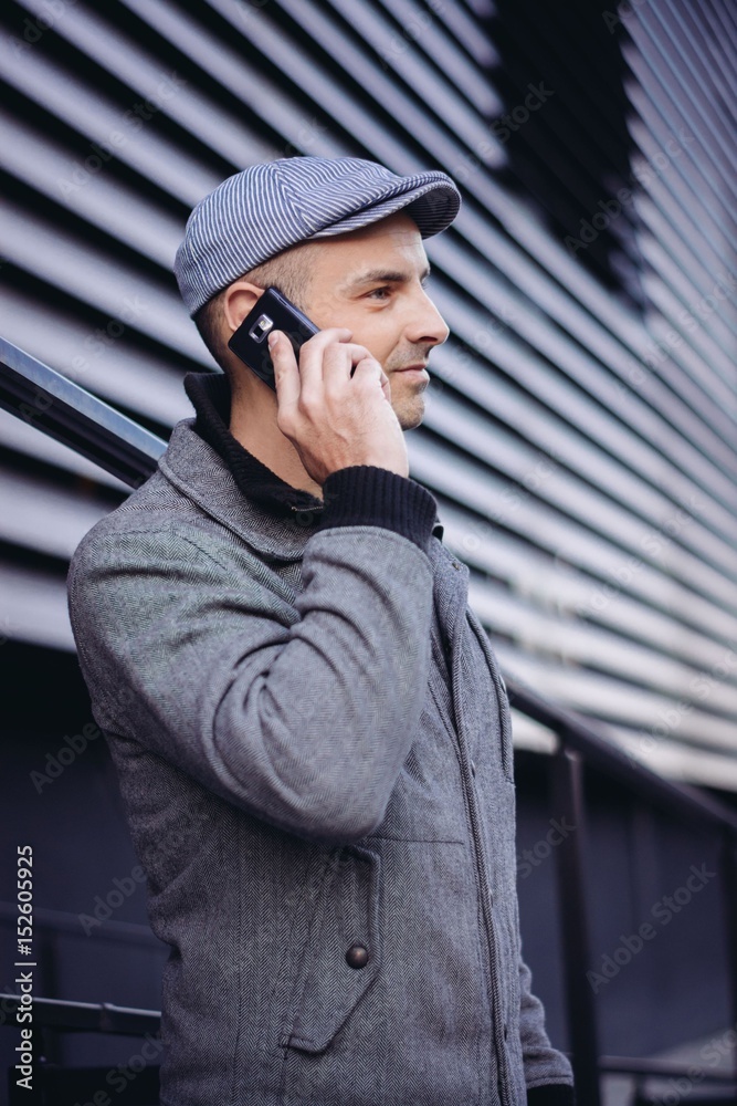 Casual man using smart phone in the city Casual man using smart phone in the city