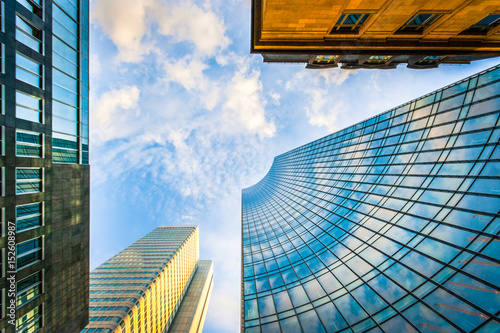 Modern skyscrapers in business district at sunset photo