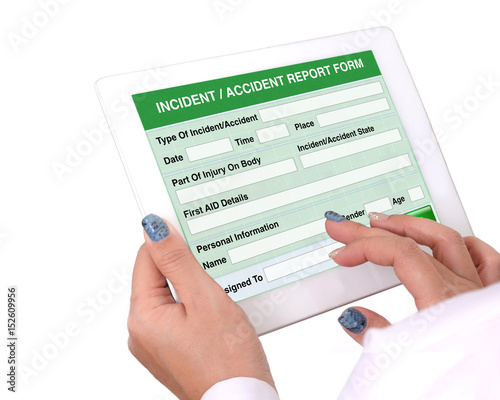 Incident or accident report form on tablet computer. photo