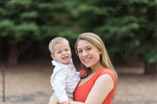 Cute Millennial Mom Holding Toddler Son