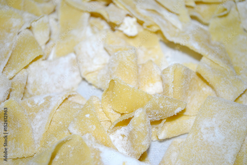 Homemade pappardelle, typical Italian pasta, close up Homemade pappardelle, typical Italian pasta, close up