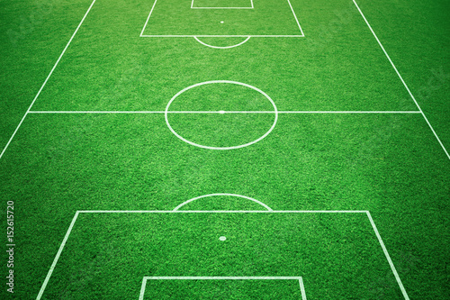 Soccer playfield ground lines on sunny grass background. Goal side perspective used.