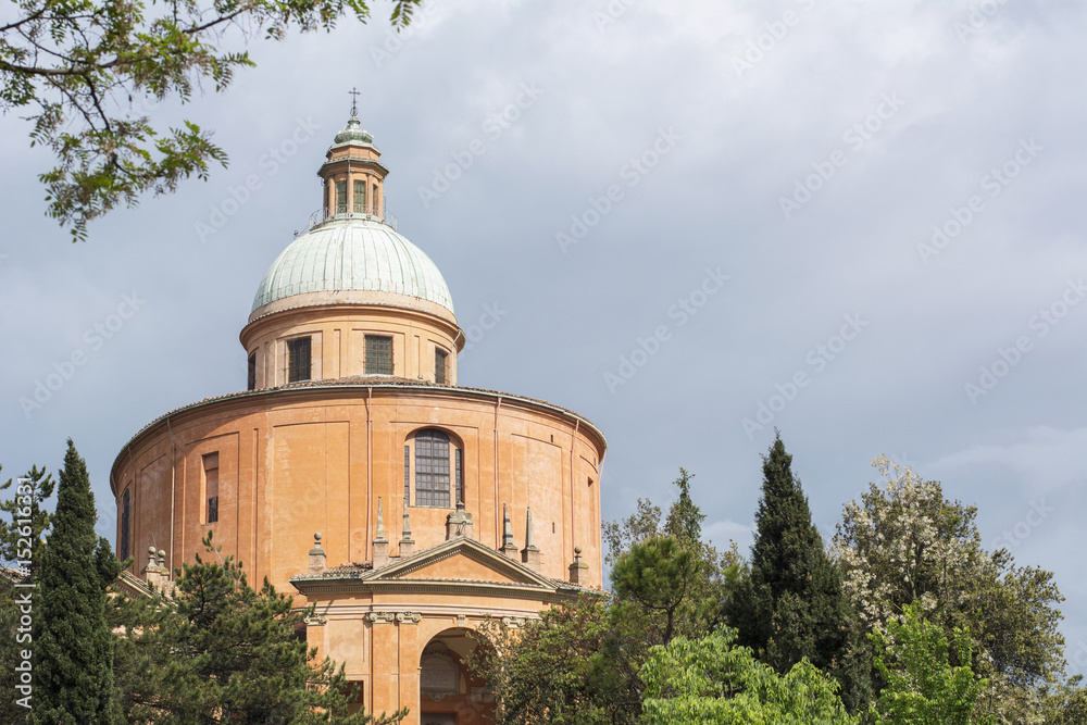 Old orange church with cloudy sky as background In Italy, Bologna (Sanctuary of the Madonna of San Luca)
