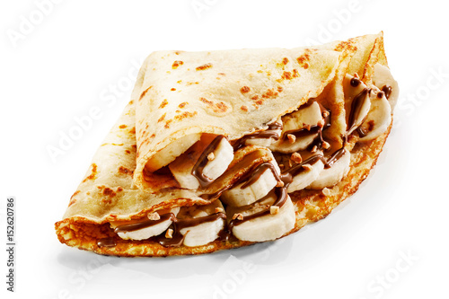Foto Banana pancake crepes with chocolate and nuts