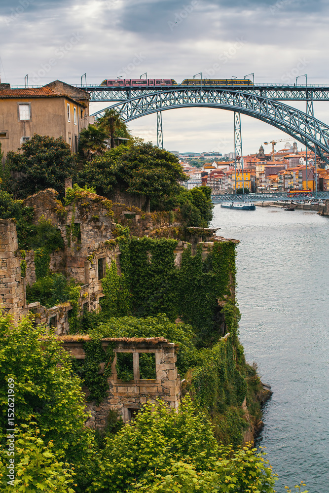 Abandoned ruins on the banks Douro river in heart of old town Porto, Portugal.