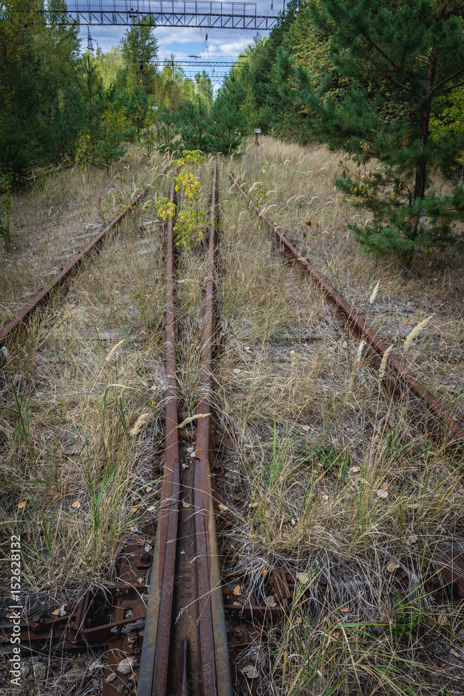 Fototapeta premium Railroad near Prypiat ghost town of Chernobyl Exclusion Zone, Ukraine