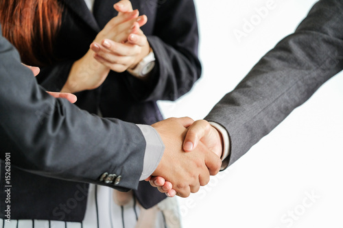 Group of business people meeting shaking hands together, business outdoor meeting concept.
