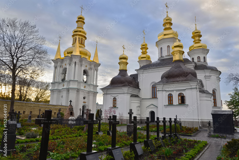 Ukraine. Kiev Pechersk Lavra. The church of the Nativity of the Most Holy Mother of God, its belltower and the monastery’s cemetery. Monks’ names and the words “Christ is risen” are on gravestones.