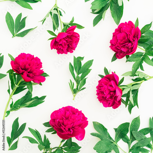 Floral pattern of peony and leaves on white background. Flat lay  top view. Pattern made of flowers