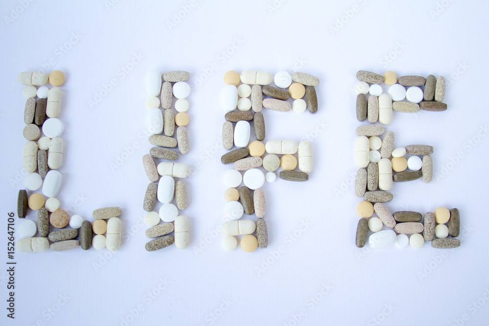 Colorful medical pills loose on a white background. Colorful medical pills loose on a white background.