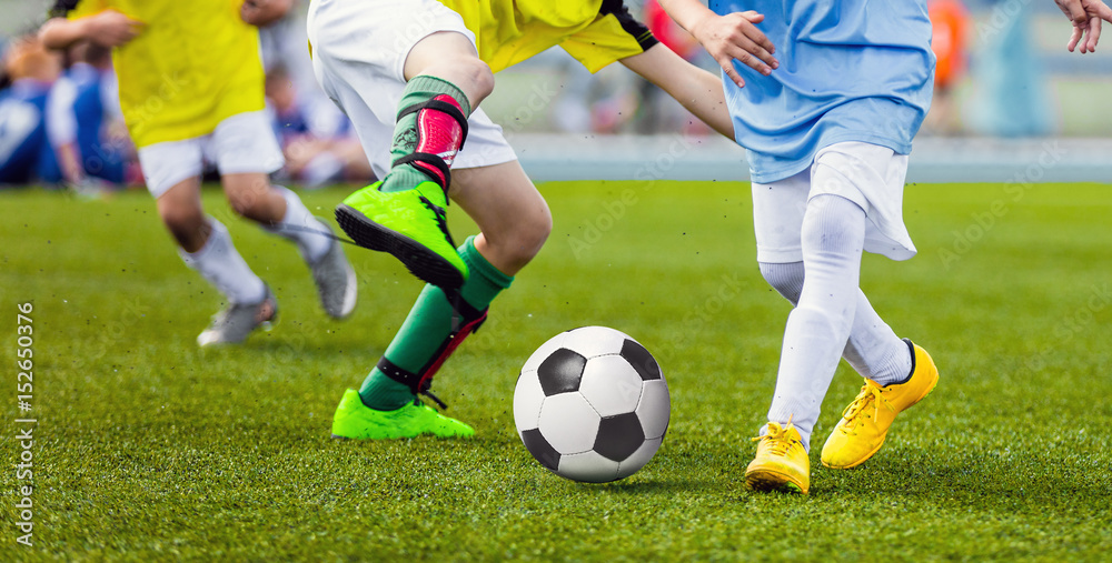 Children Football Players Running After the Ball. Kids Sport Duel. Running Youth Soccer Football Players. Boys Kicking Soccer Match Children Football Players Running After the Ball. Kids Sport Duel. Running Youth Soccer Football Players. Boys Kicking Soccer Match