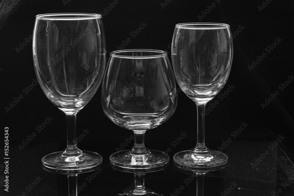 three kinds of wine glass on black background