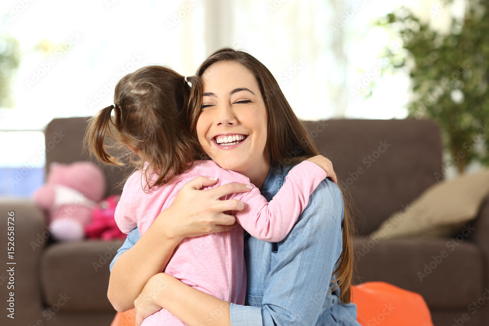 Mother embracing to her baby daughter Mother embracing to her baby daughter