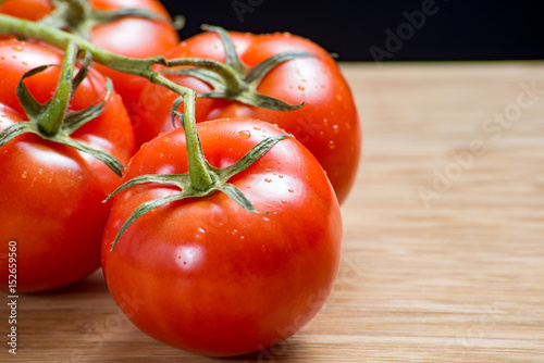 Close shot of tomato on the vine.