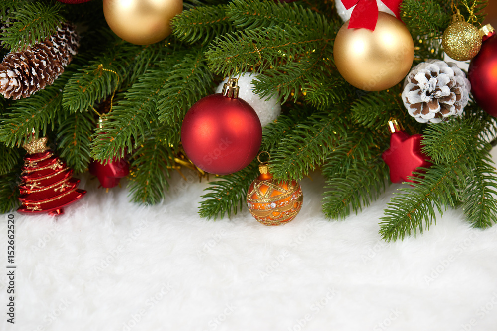 christmas decoration on fir tree branch closeup, gifts, xmas ball, cone and other object on white blank space fur, holiday concept, place for text christmas decoration on fir tree branch closeup, gifts, xmas ball, cone and other object on white blank space fur, holiday concept, place for text