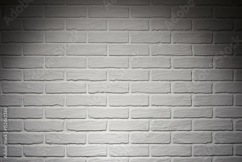 white brick wall with light effect and shadow, abstract background photo