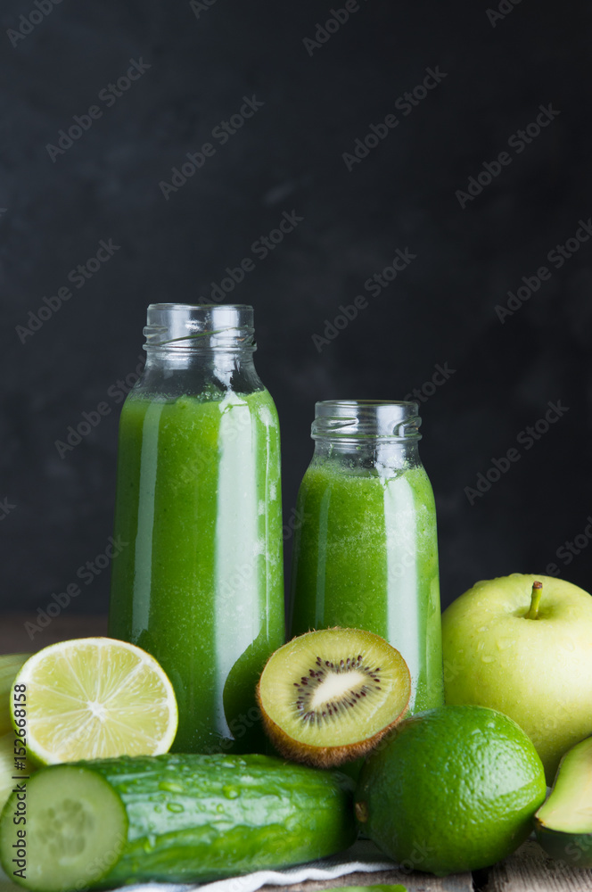Fresh green smoothies from the green fruits and vegetables.Glass bottle. Fresh green smoothies from the green fruits and vegetables.Glass bottle.