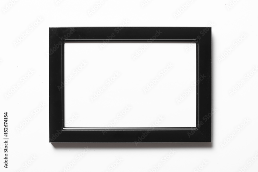 Empty copy space black photo frame isolated on white.