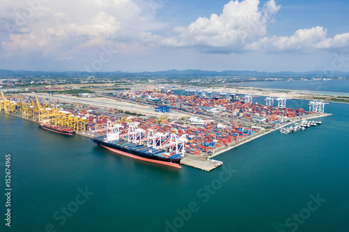 Aerial view of cargo ships loading containers at seaport © WS Films