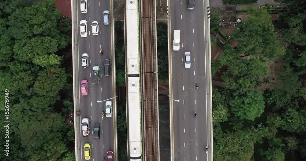 Top Down View of Traffic And Skytrain on Bangkok River Bridge
Top Down View of Traffic And Skytrain on Bangkok River Bridge