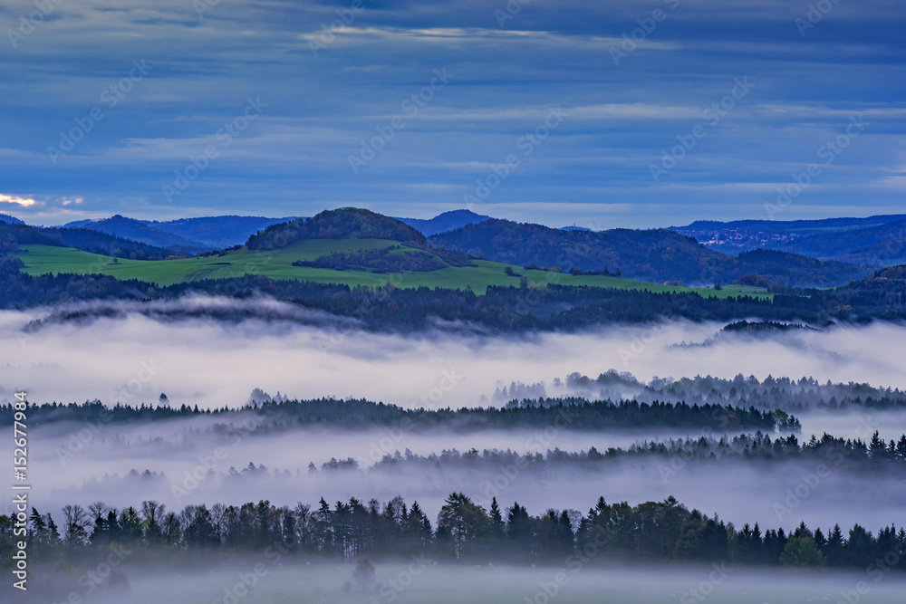 Fototapeta premium Hilly landscape with fog