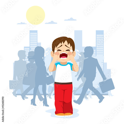 Cute little child crying because he is lost in the city with silhouette people on background