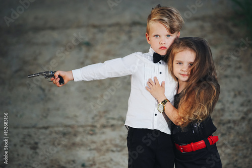 young boy and girl playing spy photo