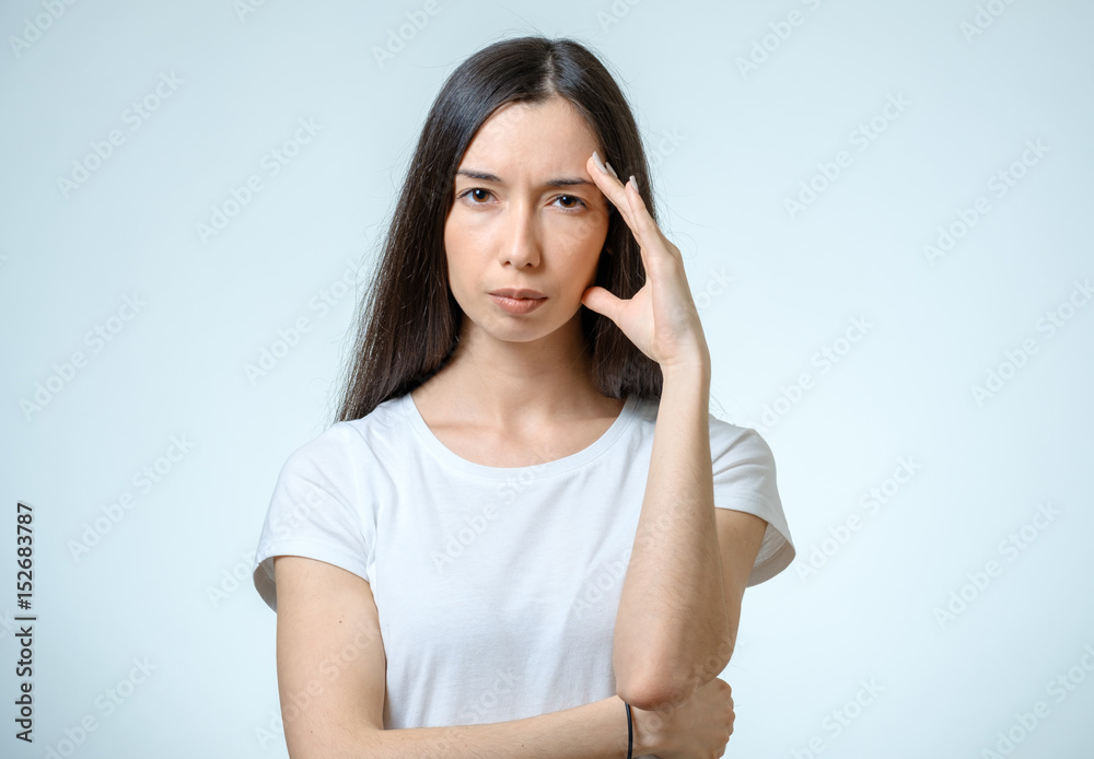 Portrait of depressed woman touching her head Portrait of depressed woman touching her head