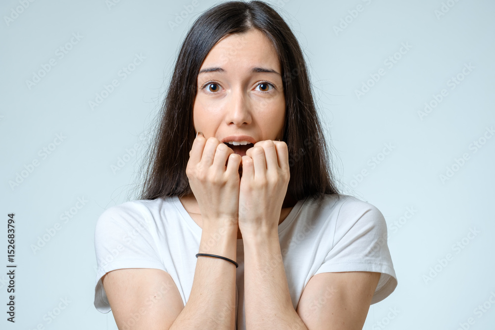 Beautiful young woman with a fear expression Beautiful young woman with a fear expression