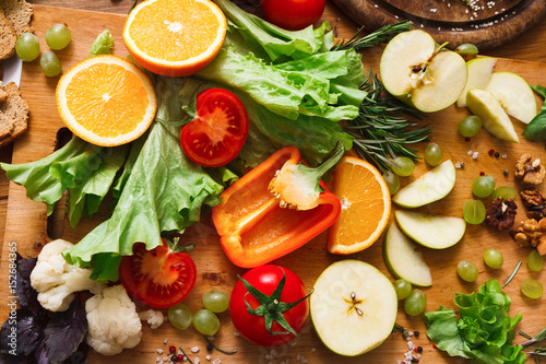 Pattern of fresh vegetables on wood background