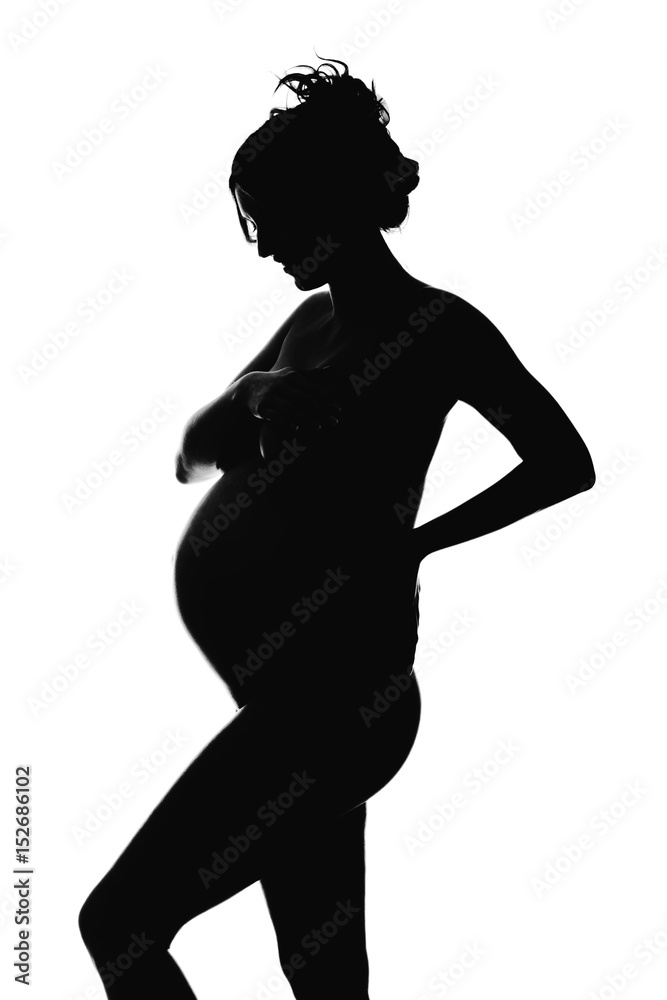 Silhouette of young pregnant woman