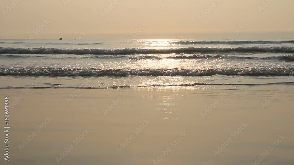 A scene of waves surfing on sandy beaches
A scene of waves surfing on sandy beaches