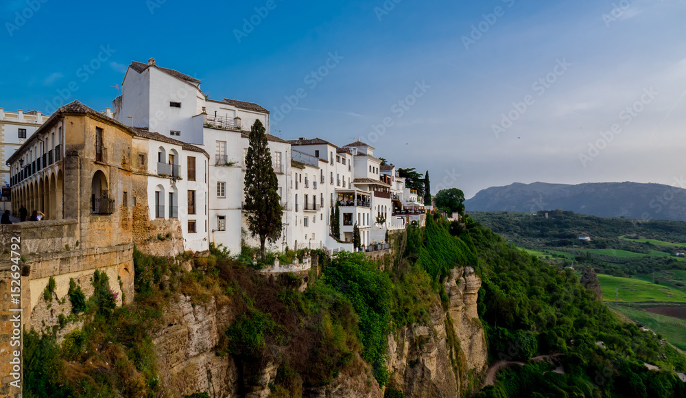 Ronda Landscape in Spain. White village in Malaga, Andalusia. Sunshine tourism in summer.